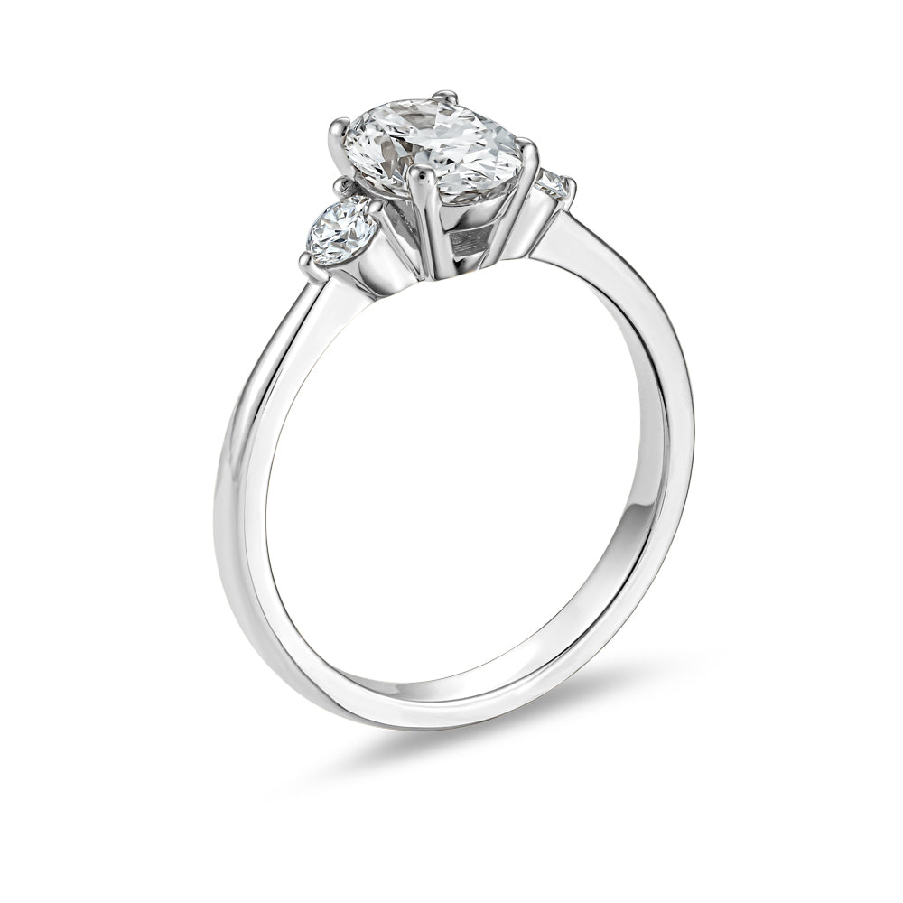 Trinity ring with 1.00 Ct oval center diamond and round side diamonds