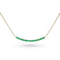 Minimalist curved bar necklace set with diamonds or emeralds in 14k gold
