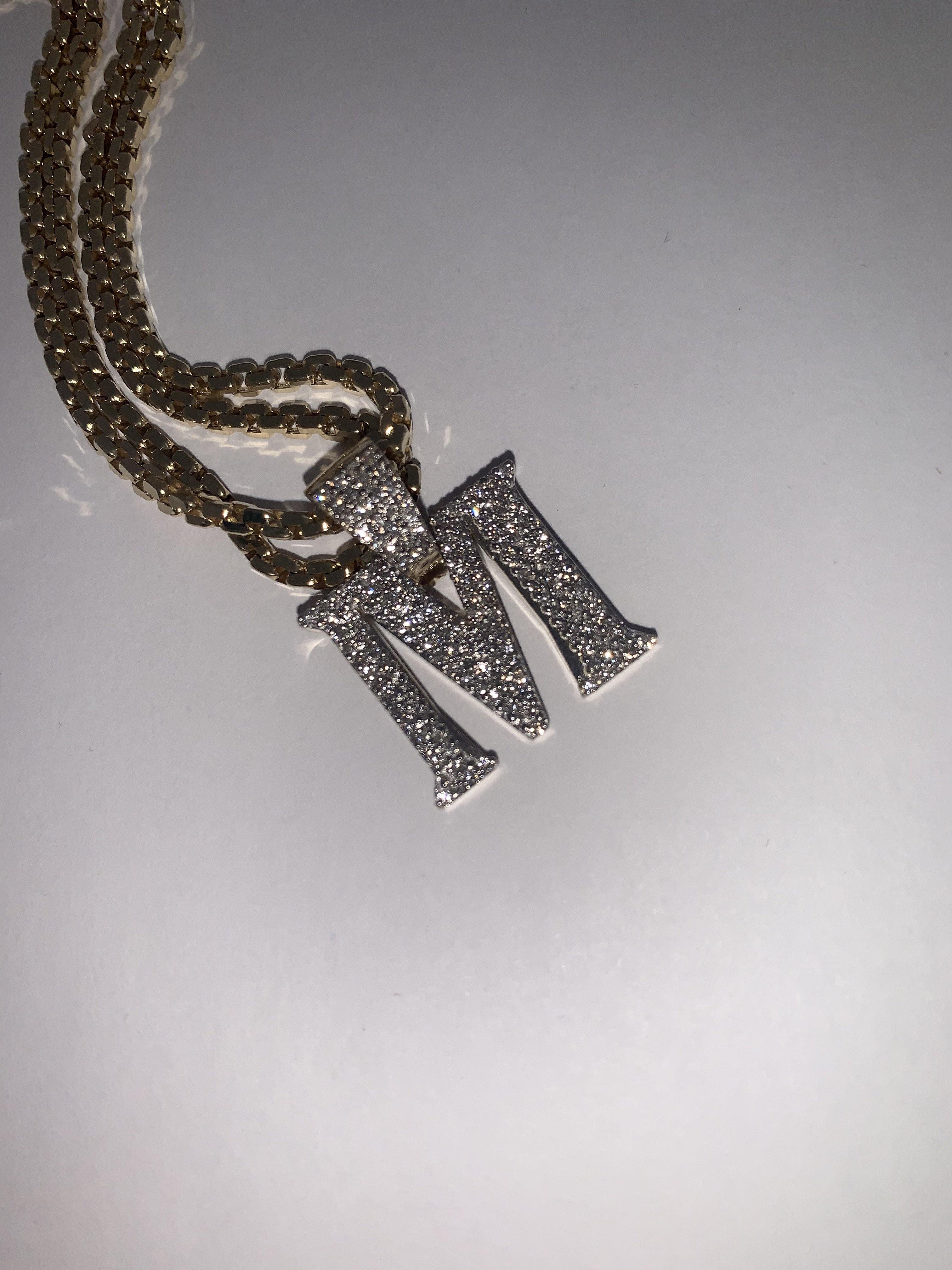 Pendentif une lettre en or 10 kt et diamants
