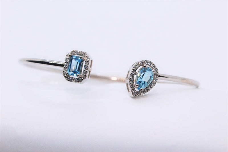 Bracelet en or 14k serti de diamants et topazes bleues